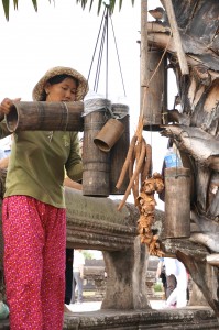 Pouring the palm juice recently tapped from a palm tree