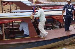 Getting into our boat for our river adventure!