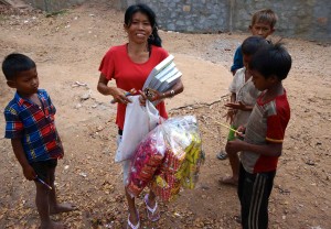 A nice lady selling pencils and notebooks for the kids