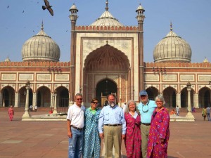 Exploring the mosque. You might notice the cloth some of us are standing on. Since you can't wear shoes, the sandstone floors can get a little toasty. Wetting and laying down the cloth helps.