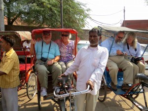 Getting ready for the rickshaw ride in Old Delhi. Our driver reminded us that "this is hard work!"