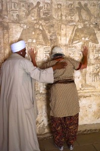 Deb praying with the locals