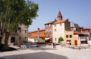 One of the city squares with old Roman column. Where is everyone?