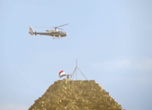 Two guys on top of Cheops Pyramid. About 15 minutes after this shot, they fell to their deaths as they tried to climb into a helicopter. Very sad but, unfortunately, just another day in Cairo...