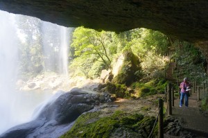 Behind the waterfall.