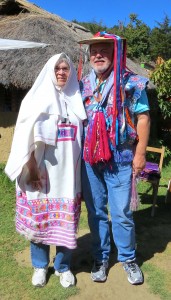 Deb and Glen in the traditional wedding attire. The women's dresses have feathers. The guy's ponchos are really colorful!