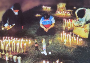 A woman praying for intercession. Note the offering of Pepsi in front of her. It reminded me of the movie "Joe versus the Volcano," but there it was Orange Crush!