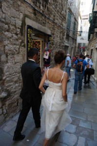 At the same time, life goes on for the locals. Here a young newly married couple is walking their way to their reception.