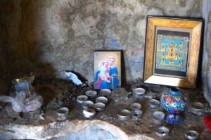 Inside the church, there were lots of votives and icons that people have left...