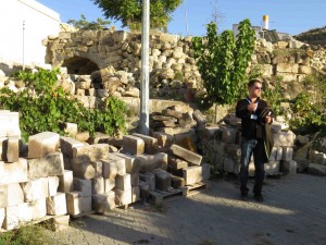 Ramazan and his materials yard -- coming in and going out.