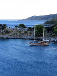 Out of the wind and safely anchored in Limani harbor.